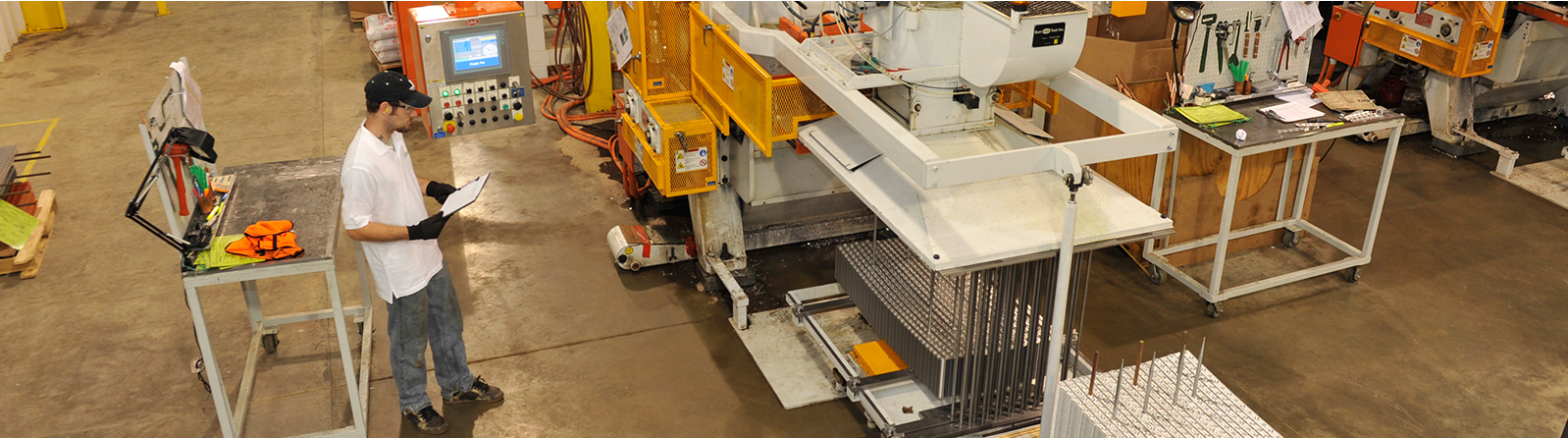 Quality control inspection on the Custom Replacement Coils fabrication floor